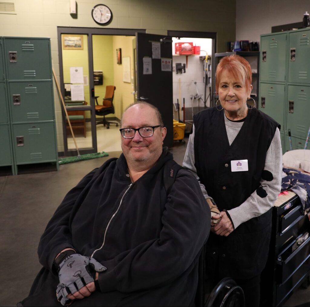 This is Tom getting a haircut from Donna a volunteer at the mission.