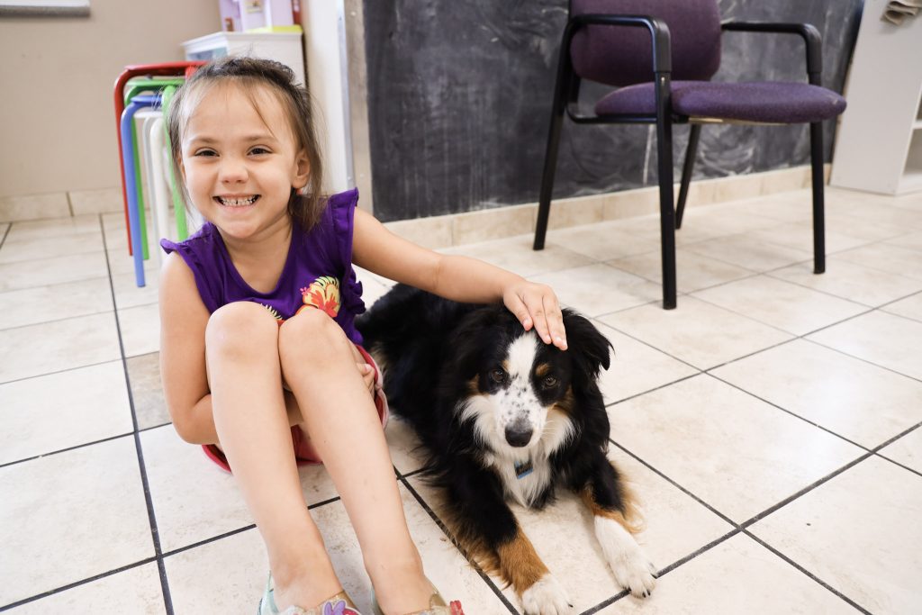 little girl with a dog