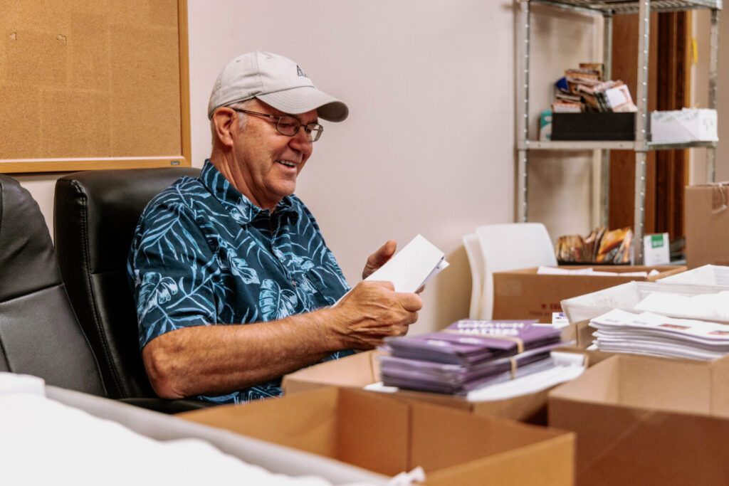 volunteer stuffing envelopes