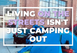 This is a image of a someone lliving on the streets in a tent.