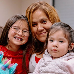 Photo of Tessa and her 2 young children.