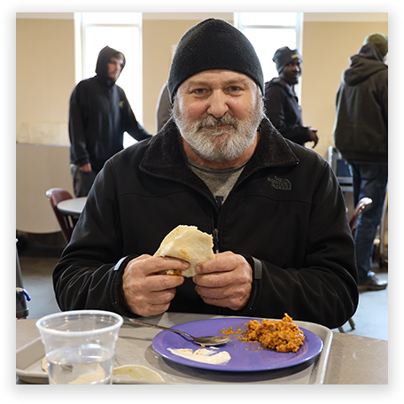man with a meal at the mission